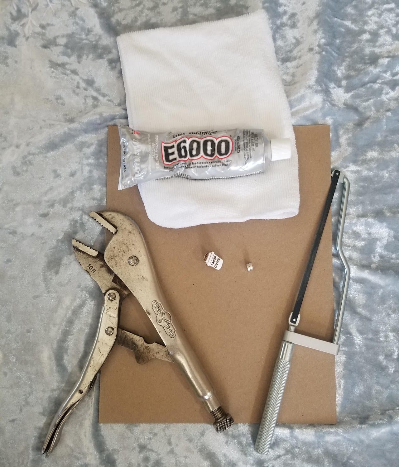 Method 1 materials: pin, vice grip, hand saw, magnets, and E6000 adhesive