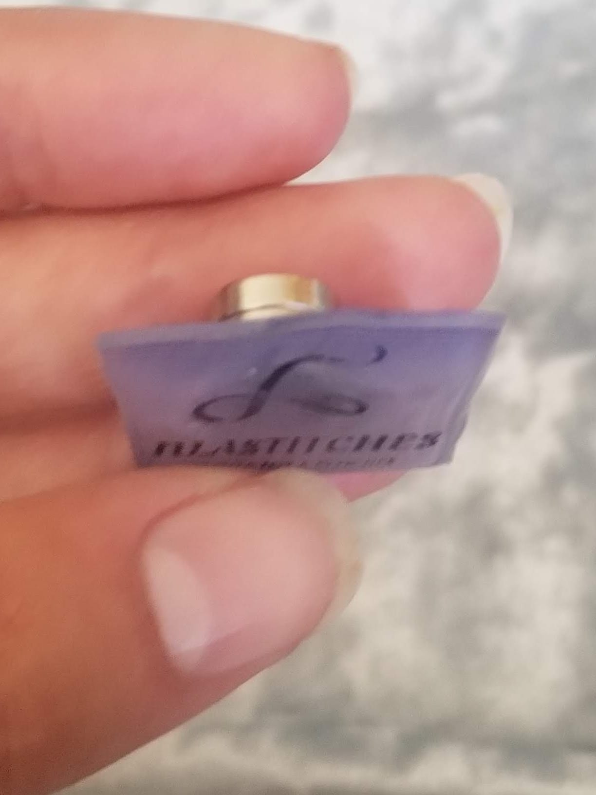 Magnet pressed onto the back, curing on cardboard