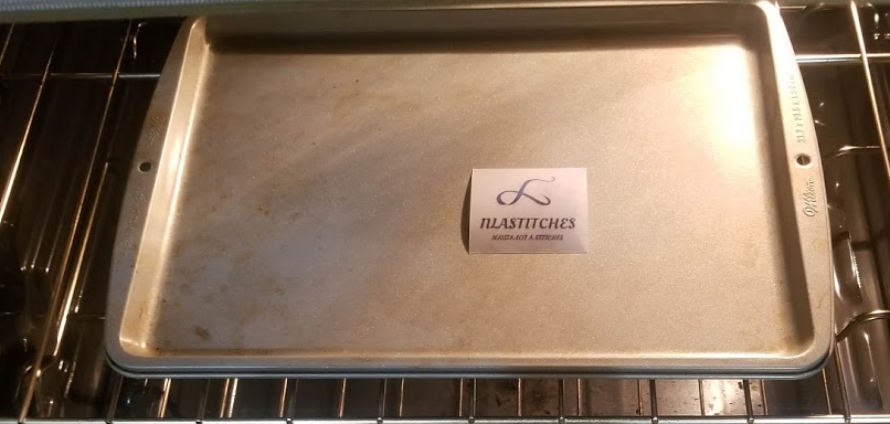 Shrink plastic curling in the oven