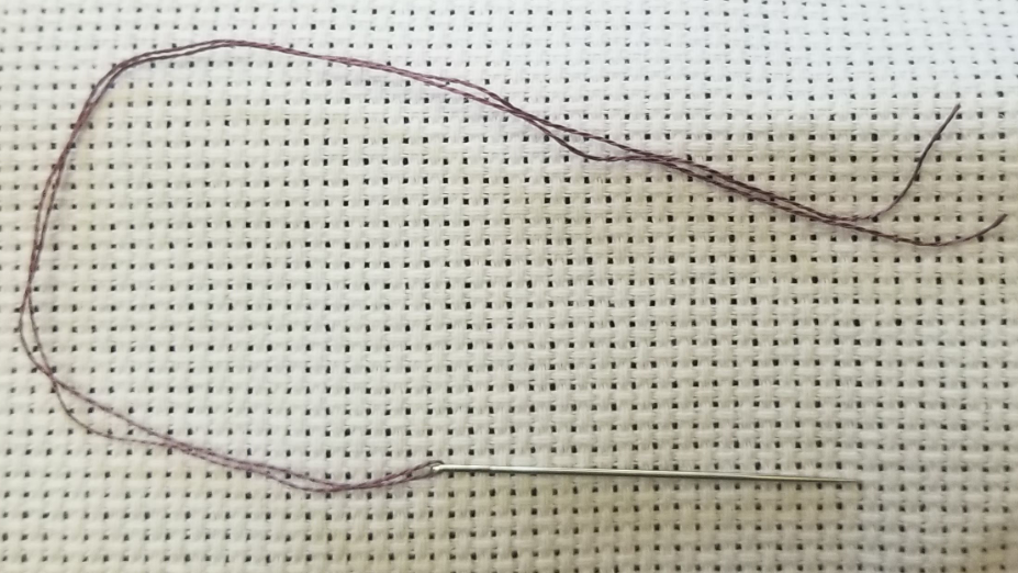Needle threaded with both ends together