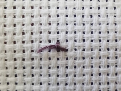 Loose ends trapped against the back of the fabric